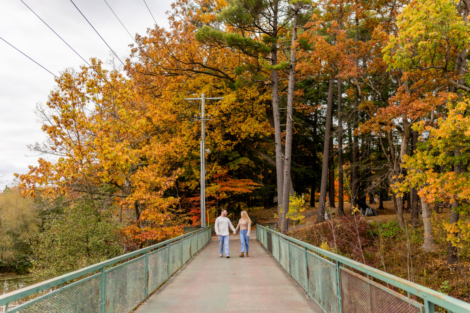 Walking hand in hand during Otterville engagement session near Delhi