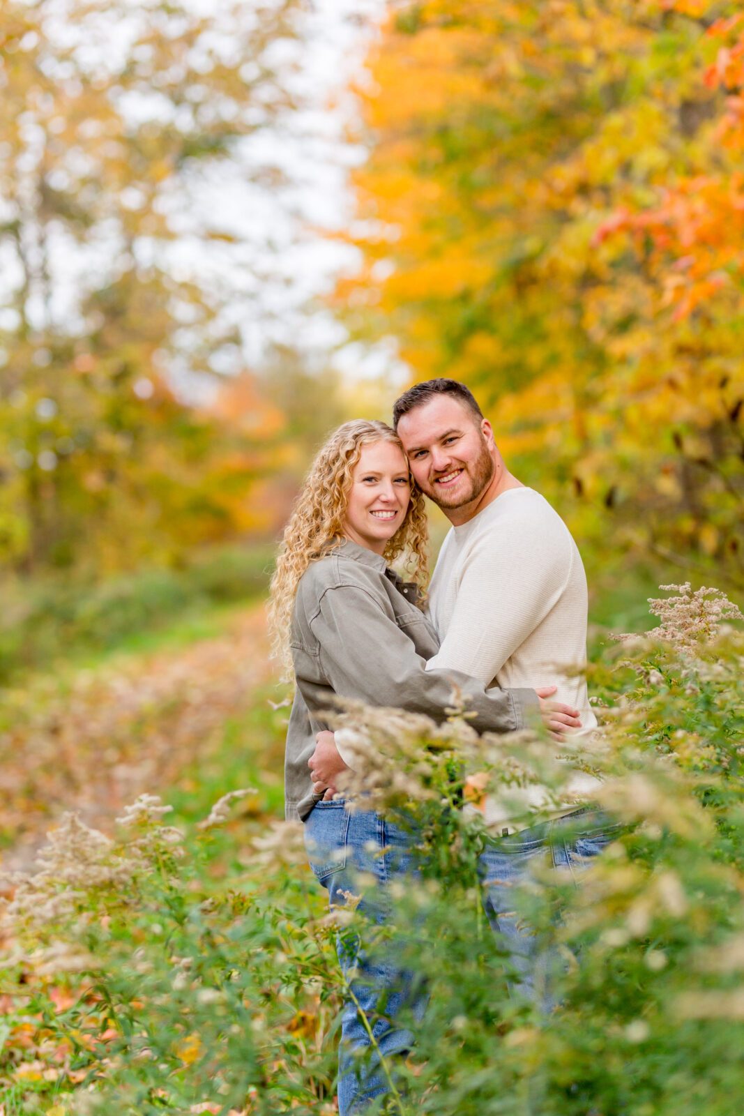 Close-up of couple laughing during fall Otterville engagement session