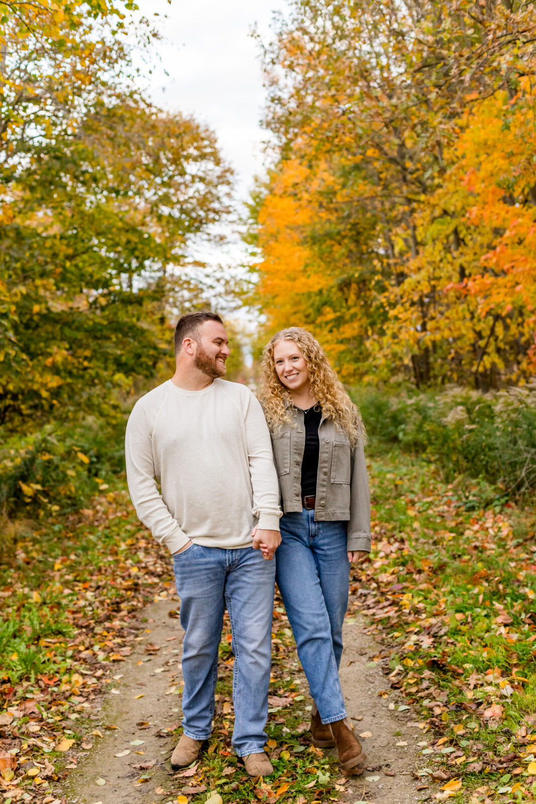 Walking hand in hand during Otterville engagement session near Delhi