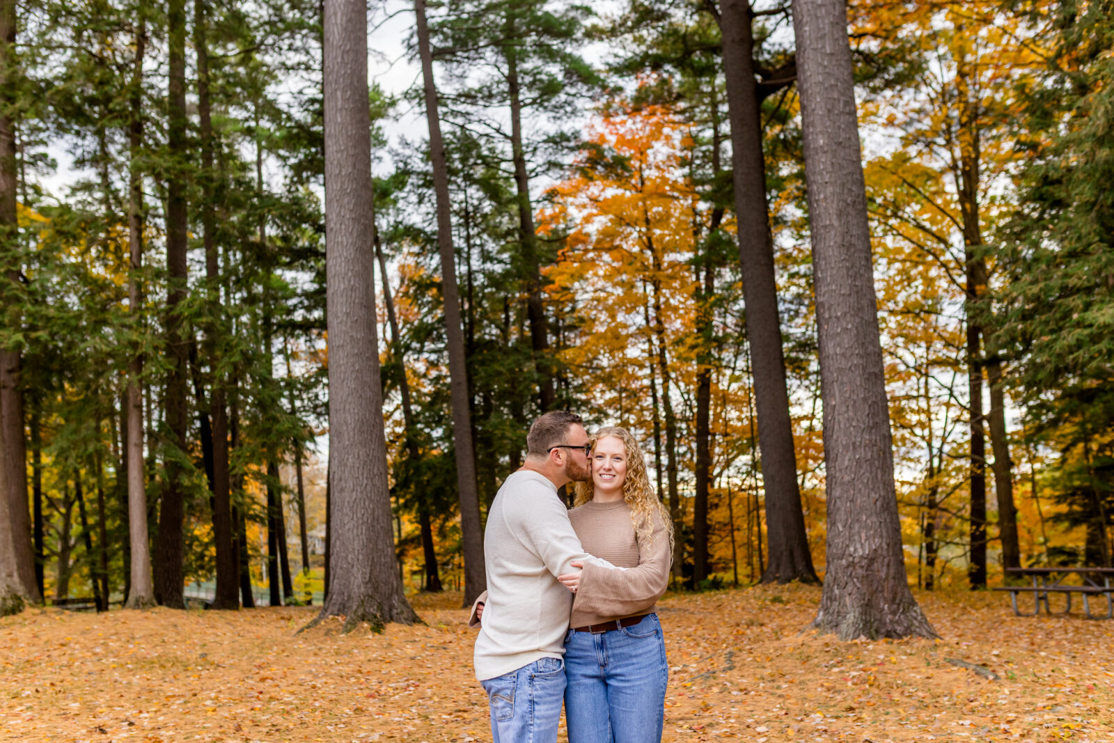 Cassie and Derrick cuddling during fall Otterville engagement session